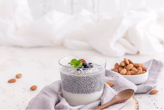 Chia pudding in a glass jar with almonds